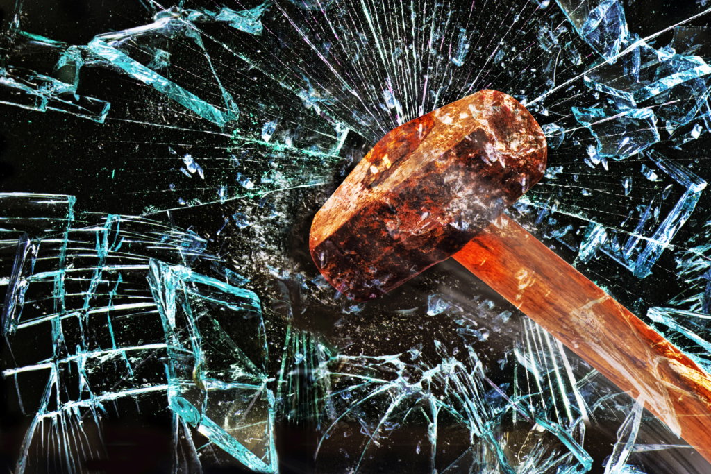 Iron hammer breaking glass window